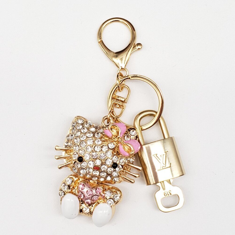 Louis Vuitton Gold Lock 🔒 Authentic LV Key + Unbranded Hello Kitty Bag Charm - Picture 6 of 8